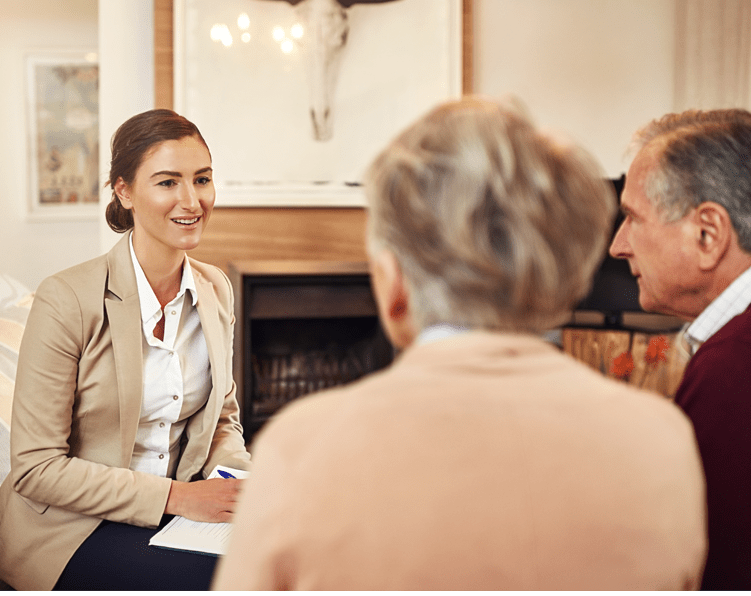 A senior care consultant meeting with elderly clients in New Orleans.